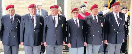  ??  ?? > Veterans and a lone piper paid tribute to D-Day hero Tony Martin, right, at his funeral this week