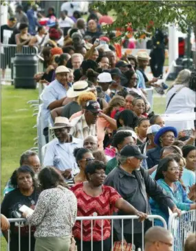  ?? PAUL SANCYA — THE ASSOCIATED PRESS ?? People stand in line outside the Charles H. Wright Museum of African American History during a public visitation for Aretha Franklin in Detroit, Wednesday.