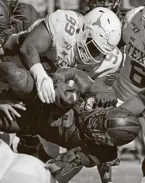  ?? Louis DeLuca / Associated Press ?? Starting defensive tackle Keondre Coburn, nicknamed “Snacks,” is part of a deep defensive line for the Longhorns.