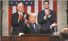  ?? Win McNamee / Associated Press ?? President Donald Trump gestures as delivers his first State of the Union address in the House chamber of the Capitol to a joint session of Congress on Tuesday, Jan. 30, 2018 in Washington, as Vice President Mike Pence and House Speaker Paul Ryan applaud.