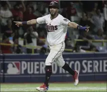  ?? Carlos Giusti ?? Minnesota Twins outfielder Eddie Rosario runs home to score in the 16th inning on a single by Ryan Lamarre, giving the Twins a 2-1 victory over the Cleveland Indians at Hiram Bithorn Stadium in
San Juan, Puerto Rico on Wednesday.
The Associated Press