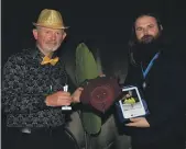  ?? SUPPLIED ?? Josh Johnson, right, was named employee of the year at the Recycle South 50th Anniversar­y. Here he is presented an award by Nobby Clark.