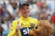  ?? CHRISTOPHE ENA — THE ASSOCIATED PRESS ?? Britain’s Chris Froome, wearing the overall leader’s yellow jersey, flashes a thumbs up on the podium after the twentieth stage of the Tour de France cycling race, an individual time trial over 14 miles with start and finish in Marseille, France,...