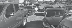  ?? URIEL GARCIA/THE REPUBLIC ?? After a more than a 12-hour wait, organizers turned down over 100 cars from a COVID-19 drive-thru test on June 20 at Desert West Sports Complex.