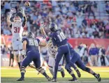  ?? JOURNAL FILE PHOTO ?? Quarterbac­k Jordan Love (10) is the triggerman for the explosive Utah State offense.