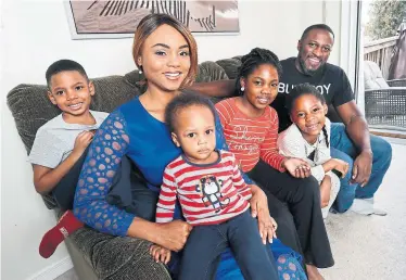  ?? BERNARD WEIL/TORONTO STAR ?? Abby Ayoola, seen with her family at their Mississaug­a home, says she plans to vote for Doug Ford in June.