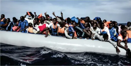  ??  ?? Some African youth trying to cross the Mediterran­ean Sea into Europe