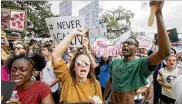  ?? AP ?? Therese Gachnauer (center) and Kwane Gatlin (right), seniors at Tallahasse­e high schools, protest gun violence on the steps of the Florida Capitol on Wednesday.