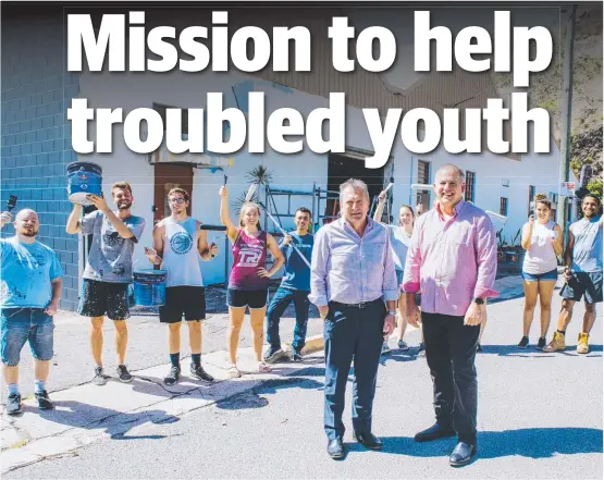  ?? ROLLING UP SLEEVES: Businessma­n Peter Tapiolas and Youth With A Mission managing director Ken Mulligan with volunteers at the Salvation Army’s old drug and alcohol recovery centre in Blackwood St. YWAM is seeking funds from all levels of government to hel ??