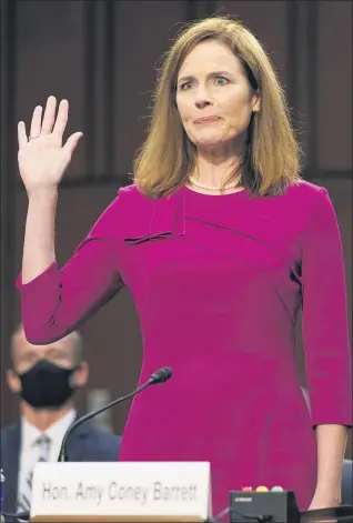  ?? PATRICK SEMANSKY — THE ASSOCIATED PRESS POOL ?? Supreme Court nominee Amy Coney Barrett is sworn in during a confirmati­on hearing before the Senate Judiciary Committee, Monday on Capitol Hill in Washington.