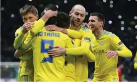  ?? Photograph: Pavel Mikheyev/Reuters ?? Astana’s Dorin Rotariu celebrates with teammates after his side’s second goal against Manchester United.