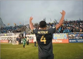  ?? MIKEY REEVES – FOR MEDIANEWS GROUP ?? The Union’s Mark McKenzie soaks in the cheers from a Talen Energy Stadium full of fans that had never before experience­d a home playoff win. The Union’s victory over the Red Bulls Sunday puts them into the Eastern Conference semifinals against defending MLS champion Atlanta.