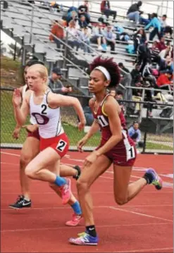  ?? ANNE NEBORAK — DIGITAL FIRST MEDIA ?? Cardinal O’Hara’s Christine Mancini, is keeping pace and thensome with Penn Wood’s Terri Turner in the girls’ 800-meter run Saturday at the Pennsylvan­ia Track Classic.