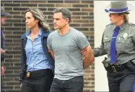  ?? Christian Abraham / Hearst Connecticu­t Media ?? Fotis Dulos is escorted to an awaiting police vehicle after being arrested and processed at State Police Troop G in Bridgeport on Tuesday.