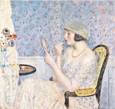  ?? ?? Woman at a Dressing Table by the American artist Frederick Carl Frieseke (1874-1939)