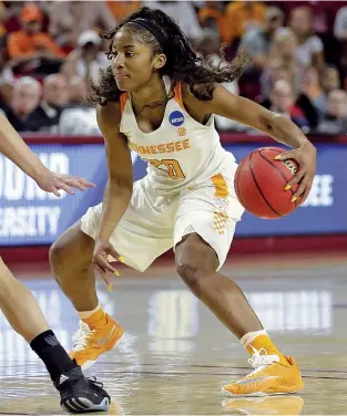  ??  ?? Tennessee guard Te’a Cooper drives against Green Bay during the first half Friday of a first-round game in the NCAA women’s tournament in Tempe, Ariz. Cooper scored 15 points in a 59-53 win.