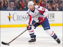  ?? WINSLOW TOWNSON/AP PHOTO ?? Capitals defenseman Kevin Shattenkir­k works with the puck during a game against the Bruins on April 8 at Boston.