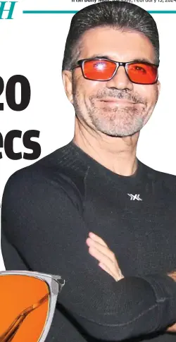  ?? ?? All smiles: Cowell in glasses