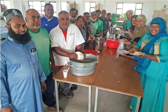  ?? Photo: Nicolette Chambers ?? Masjid Ul Hilal Mosque head priest, Rameez Riza Ali (first from left) together with the members of the mosque and the women at the Eid Mela celebratio­n at Saweni, Lautoka on May 22, 2022.