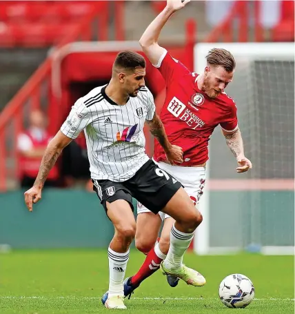  ?? ?? Above left, Kasey Palmer scores Bristol City’s leveller in Saturday’s Sky Bet Championsh­ip 1-1 draw at Ashton Gate. Above right, City’s Tomas Kalas challenges Fulham’s Aleksandar Mitrovic. Below, City boss Nigel Pearson