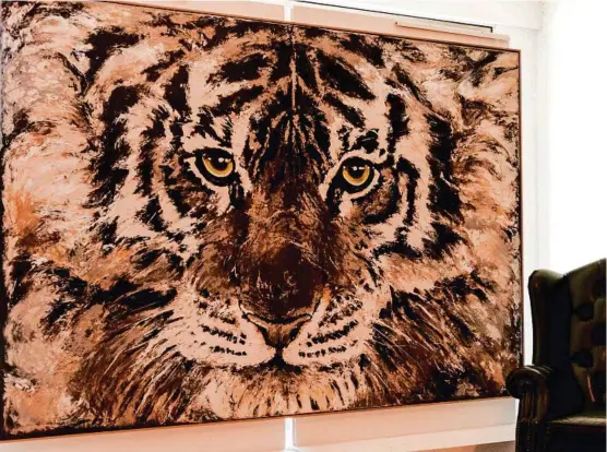  ??  ?? “Prestigiou­s”, the $18,000 tiger is on display in the foyer next to Milk &amp; Honey Expresso Bar until the Grammar Art Show