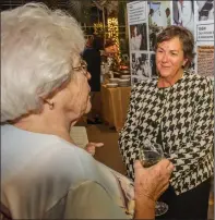  ??  ?? Cathy MacPherson, right, talks to Mary Cannistra, the wife of Dr. Franscisco Cannistra, during last week’s Thundermis­t 50th anniversar­y gala.