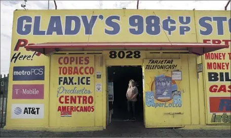  ?? Gary Coronado Los Angeles Times ?? GLADYS COLCHADO, 61, stands in her convenienc­e store on Vermont Avenue, where she and her family hid as neighborin­g businesses went up in flames during the 1992 uprising. “People are still living on minimum wage. There’s just no way to succeed in this area.”