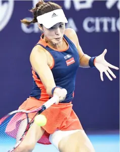  ?? — AFP photo ?? Wang Qiang hits a return during her women’s singles second round match against Jelena Ostapenko at the China Open tennis tournament in Beijing.