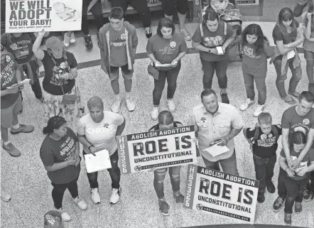  ?? JAY JANNER/AP FILE ?? Anti-abortion demonstrat­ors gather on March 30 in Austin, Texas. Texas passed a law that bans abortions after about six weeks.