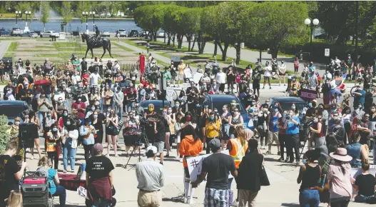  ?? PHOTOS: TROY FLEECE ?? Speakers address the hundreds of people who attended Tuesday’s rally in front of the Saskatchew­an Legislativ­e Building in response to recent deaths in both Canada and the United States in which they said racism played a role.