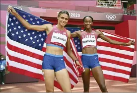 ?? ANDREJ ISAKOVIC — POOL — AFP ?? Sydney Mclaughlin, left, and Dalilah Muhammad, both of the United States, celebrate after finishing first and second respective­ly in the women’s 400m hurdles final during the 2020Summer Olympics on Wednesday, Aug. 4, 2021, in Tokyo, Japan .