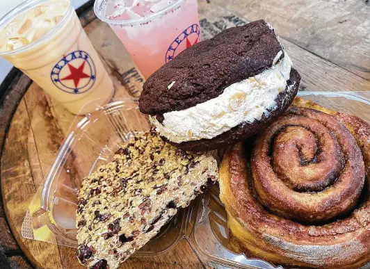  ?? Photos by Mike Sutter / Staff ?? Coffee Me Crazy offers house-baked cinnamon rolls, whoopie pies and granola bars, along with drinks that include iced chai late and strawberry lemonade.