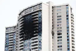  ?? — AFP ?? HONOLULU: The charred exterior of the Marco Polo Building is pictured after a fire broke out on the upper floors on Friday.