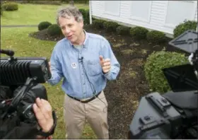  ?? PHIL LONG — THE ASSOCIATED PRESS ?? Sen. Sherrod Brown, D-Ohio, talks with reporters after voting in Cleveland.