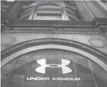  ??  ?? This file photo taken on February 14, 2017 shows an Under Armour store in Manhattan in New York City. Shares of Under Armour stumbled early October 31, 2017 after the athletic apparel and shoe maker slashed its full-year profit forecast following weak...