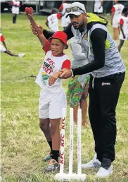  ??  ?? EXPERT TIPS: Luciano Nel gets some bowling advice from Warriors fast bowler Basheer Walters at the annual KFC Mini-Cricket Provincial Festival held on Saturday