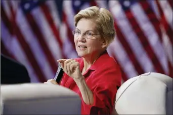  ?? JOHN LOCHER — THE ASSOCIATED PRESS ?? In this file photo, Democratic presidenti­al candidate Sen. Elizabeth Warren, D-Mass., speaks during a gun safety forum in Las Vegas. Bernie Sanders and Elizabeth Warren raked in more cash over the past three months than any of their Democratic rivals.