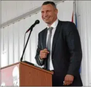  ?? JOHN BREWER - ONEIDA DAILY DISPATCH ?? Former heavyweigh­t champion and Class of 2018induct­ee Vitali Klitschko jokes during his acceptance speech at the Internatio­nal Boxing Hall of Fame Induction Museum Grounds on Sunday, June 10, in Canastota.