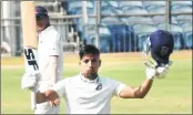  ??  ?? Maharashtr­a’s Swapnil Gugale celebrates after scoring a century against Mumbai during a Ranji Trophy match in Pune on Thursday