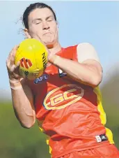  ?? ?? The Suns’ Tom Berry marks during the match simulation against Essendon. Picture: Getty