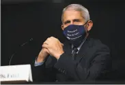  ?? Alex Edelman / Associated Press ?? Dr. Anthony Fauci stresses Americans need to keep up preventive measures such as wearing masks.