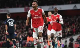  ??  ?? Pierre-Emerick Aubameyang celebrates scoring Arsenal’s third goal, which turned out to be the winner, against Everton. Photograph: David Price/Arsenal FC via Getty Images