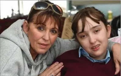  ?? Photo by Dominick Walsh. ?? Margaret McElligot from Kilfynn pictured at home with her 16 year old daughter, Tina, who suffers from the rare genetic condition Alpers Syndrome.