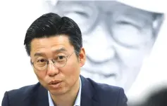  ?? — Reuters photo ?? Baek Cheon-ho, a senior executive in charge of Hyundai Asan’s North Korea business, speaks as Hyundai Group founder Chung Ju-yung’s portrait is seen in the background in Seoul, South Korea.