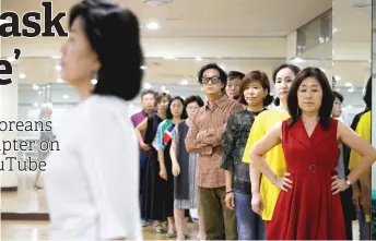  ??  ?? Middle-aged people attend a senior model class in Seoul, South Korea. — Reuters photos