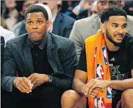  ?? KATHY WILLENS/THE ASSOCIATED PRESS ?? Raptors point guard Kyle Lowry, left, out indefinite­ly after wrist surgery, has still been on hand for the team as young guards Cory Joseph, right, Fred VanVleet and Delon Wright have tried to fill the void left by their star teammate.