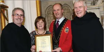  ??  ?? top: David and Anthony Briscoe with their dad Seamie with his Mayoral Awards at the Highlanes Gallery.
Above: Mayor Pio Smith Presenting Fr Colm O Mahony Augustinia­n Church Community with their Mayoral Award also in the Photo his Mum Margaret and Fr...