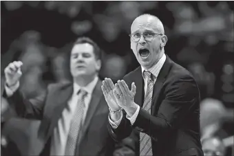  ?? STEPHEN DUNN/AP PHOTO ?? UConn head coach Dan Hurley cheers on his team during the second half of Sunday’s win over South Florida in Storrs. the Huskies host Central Florida tonight at the XL Center.