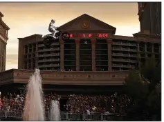  ?? AP/JOHN LOCHER ?? Travis Pastrana jumps the Caesars Palace fountain on a motorcycle Sunday in Las Vegas.