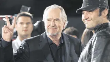  ?? Matt Sayles
Associated Press ?? ‘A CONSUMMATE FILMMAKER’ Wes Craven, left, and Robert Rodriguez pose at the premiere of Craven’s “Scream 4” in Los Angeles in 2011.
For Craven, making a scary movie was far more than simply a matter of delivering cheap shocks.